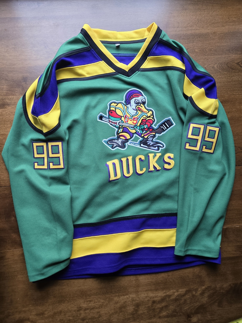 Vintage Mighty Ducks “Banks 99” hockey jersey in classic green, purple, and gold